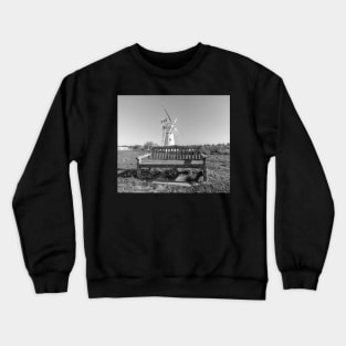 Wooden bench and traditional windmill on the riverbank Crewneck Sweatshirt